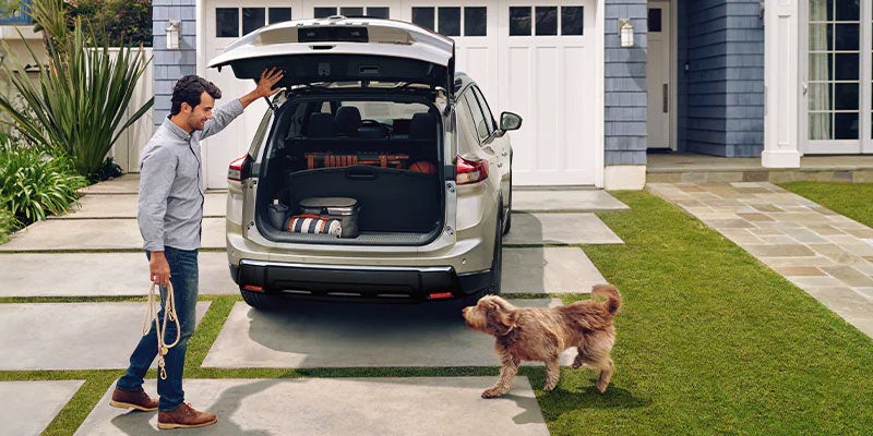 Rear view of 2024 Nissan Rogue with open trunk