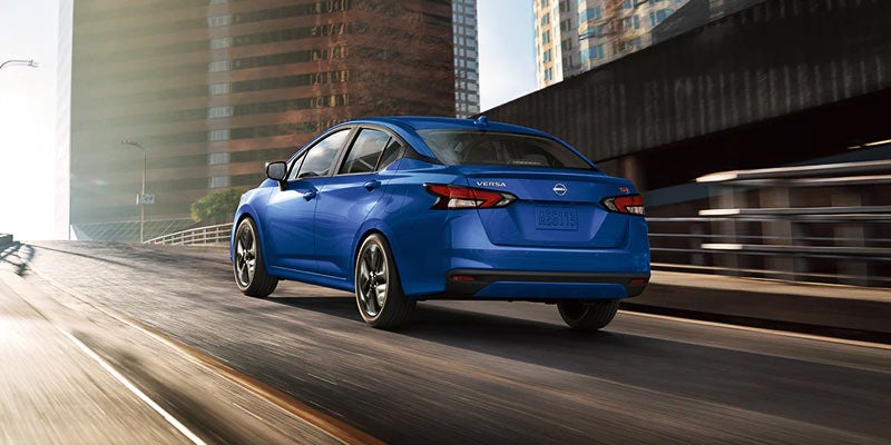 2024 Nissan Versa image of blue Versa driving in a city